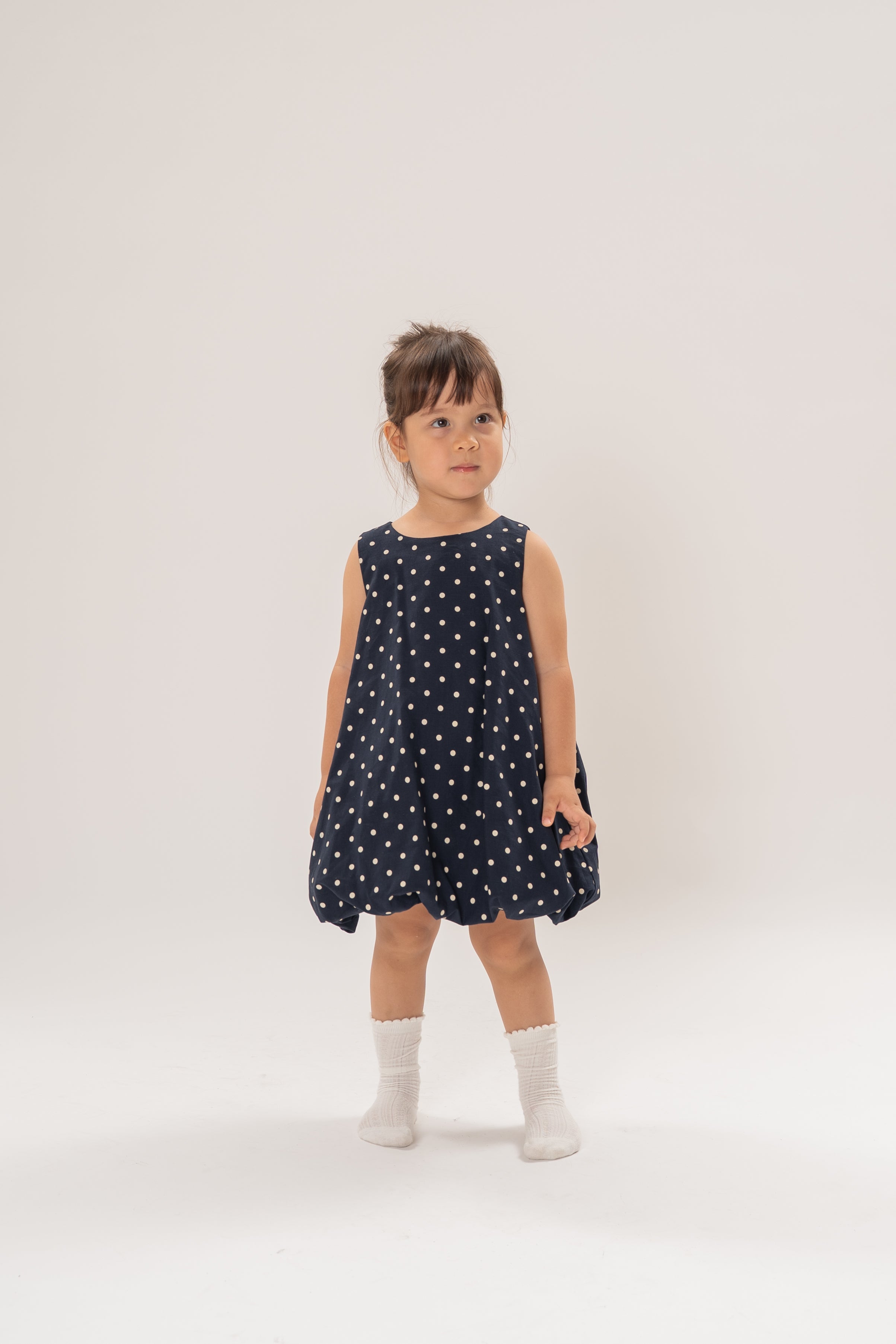 Mini Bubble Hem A-Line Dress in Polka Dot Navy