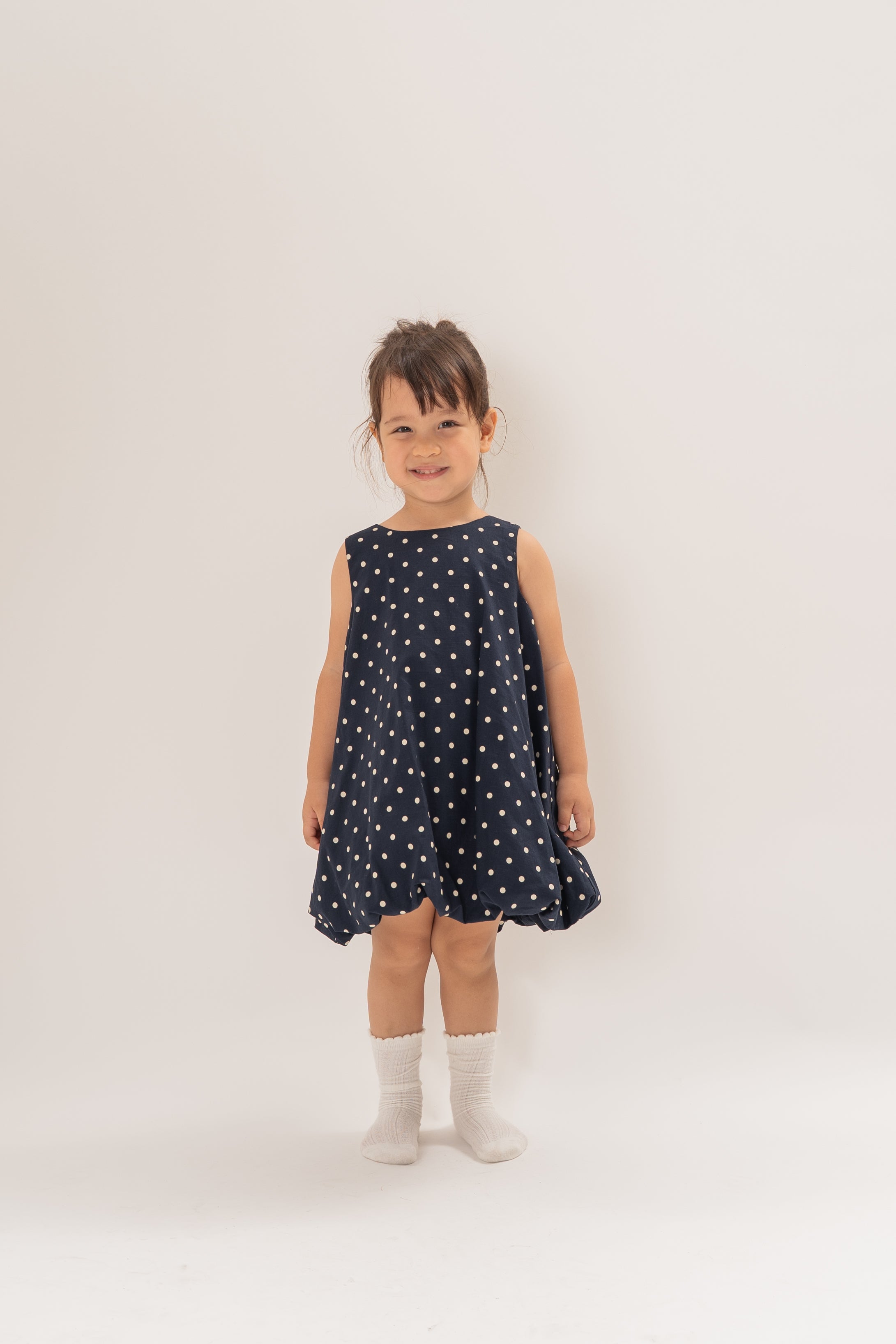 Mini Bubble Hem A-Line Dress in Polka Dot Navy