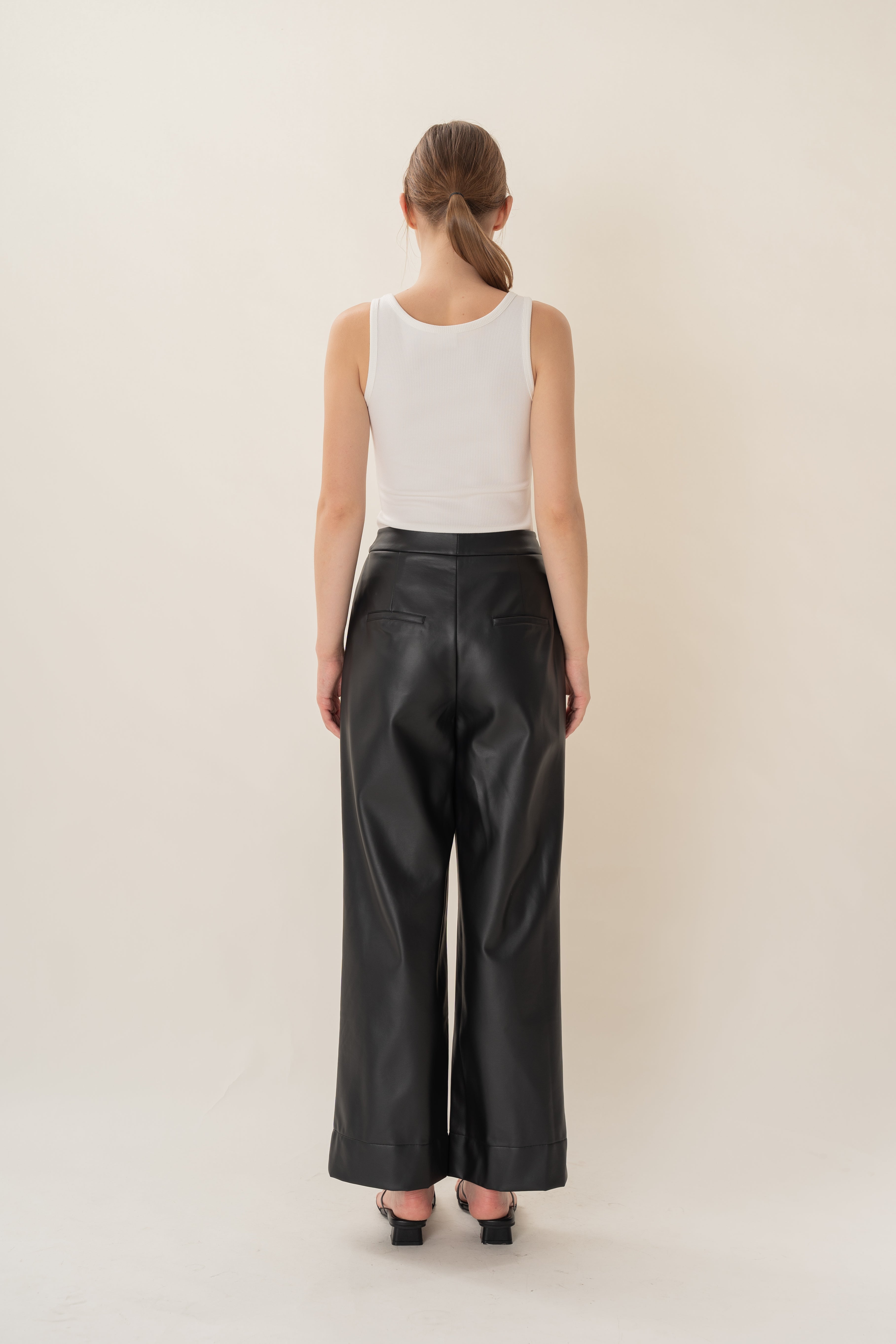 Faux Leather Pleated Trousers in Black