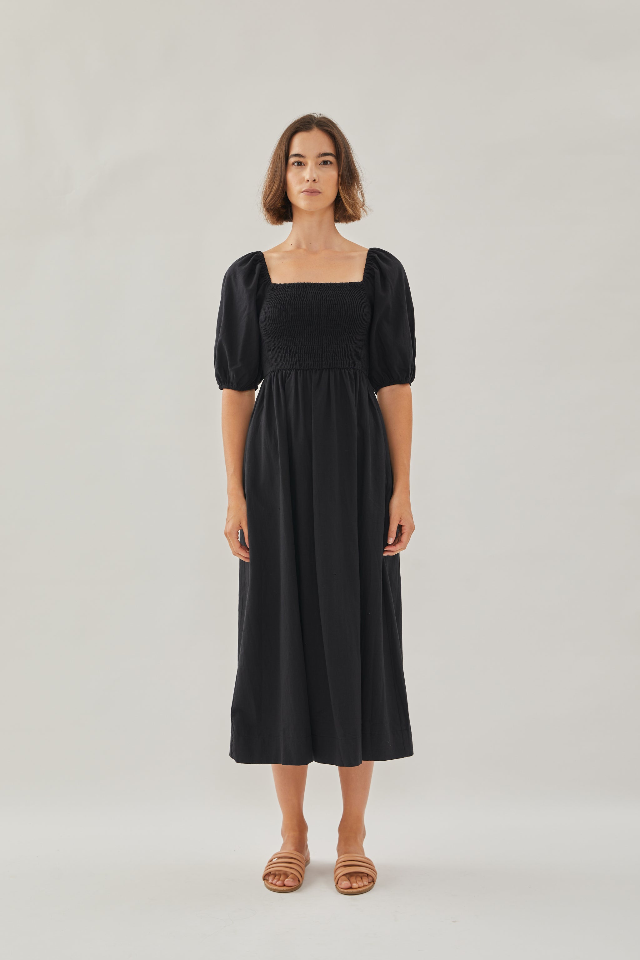 Puffed Sleeved Shirred Midi Dress in Black Puffed Sleeved Shirred Midi Dress in Black