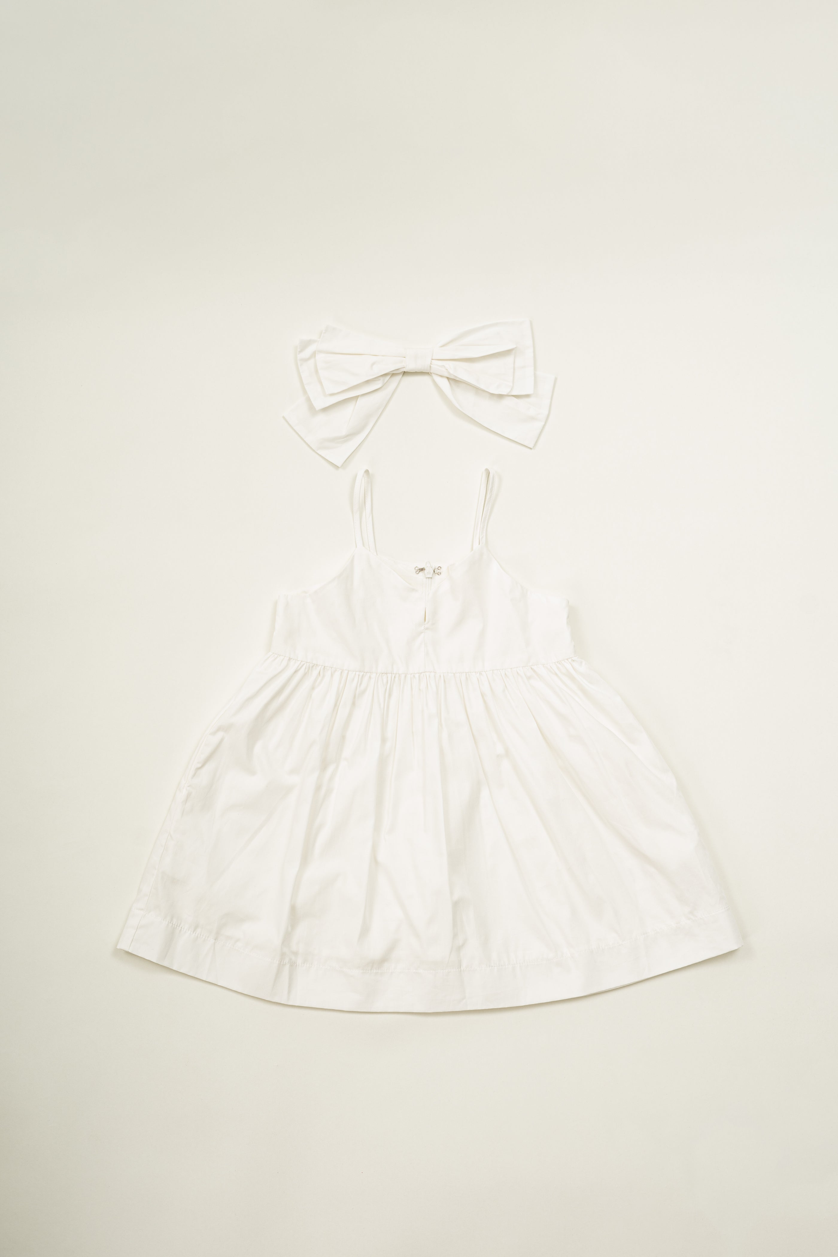 Mini Sleeveless Dress With Detachable Bow in White