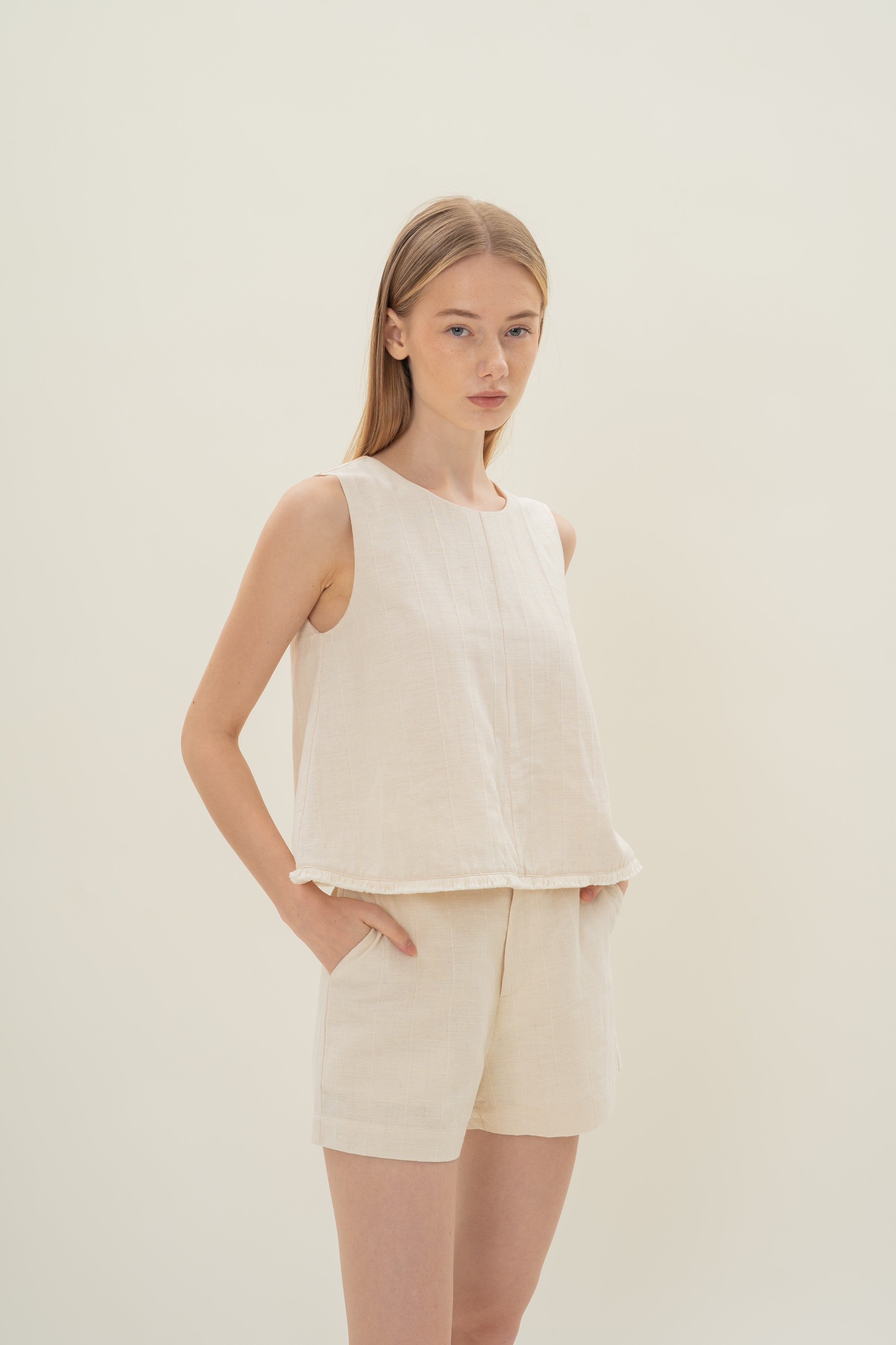 Frilled Hem Sleeveless A-Line Top in Natural