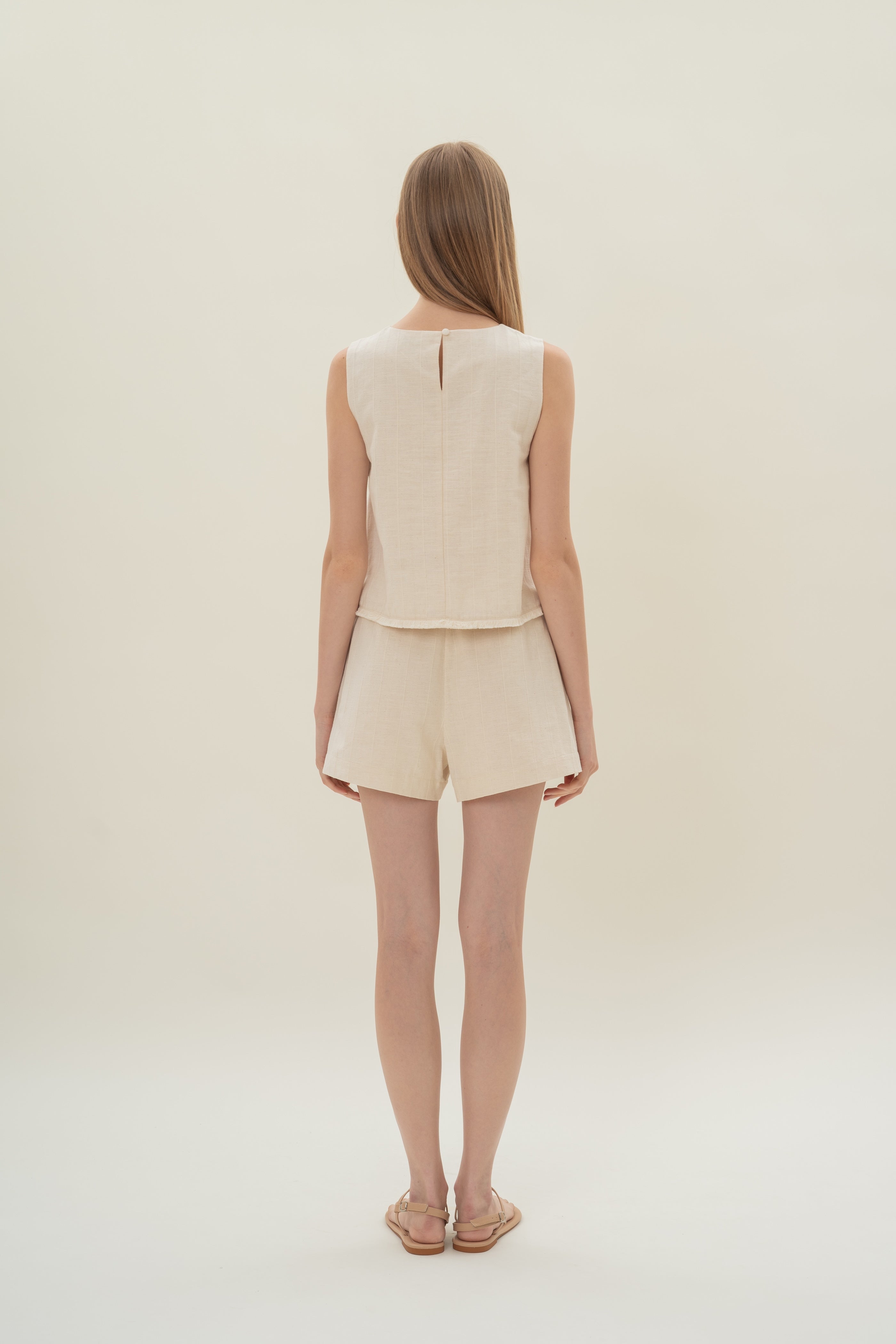 Frilled Hem Sleeveless A-Line Top in Natural
