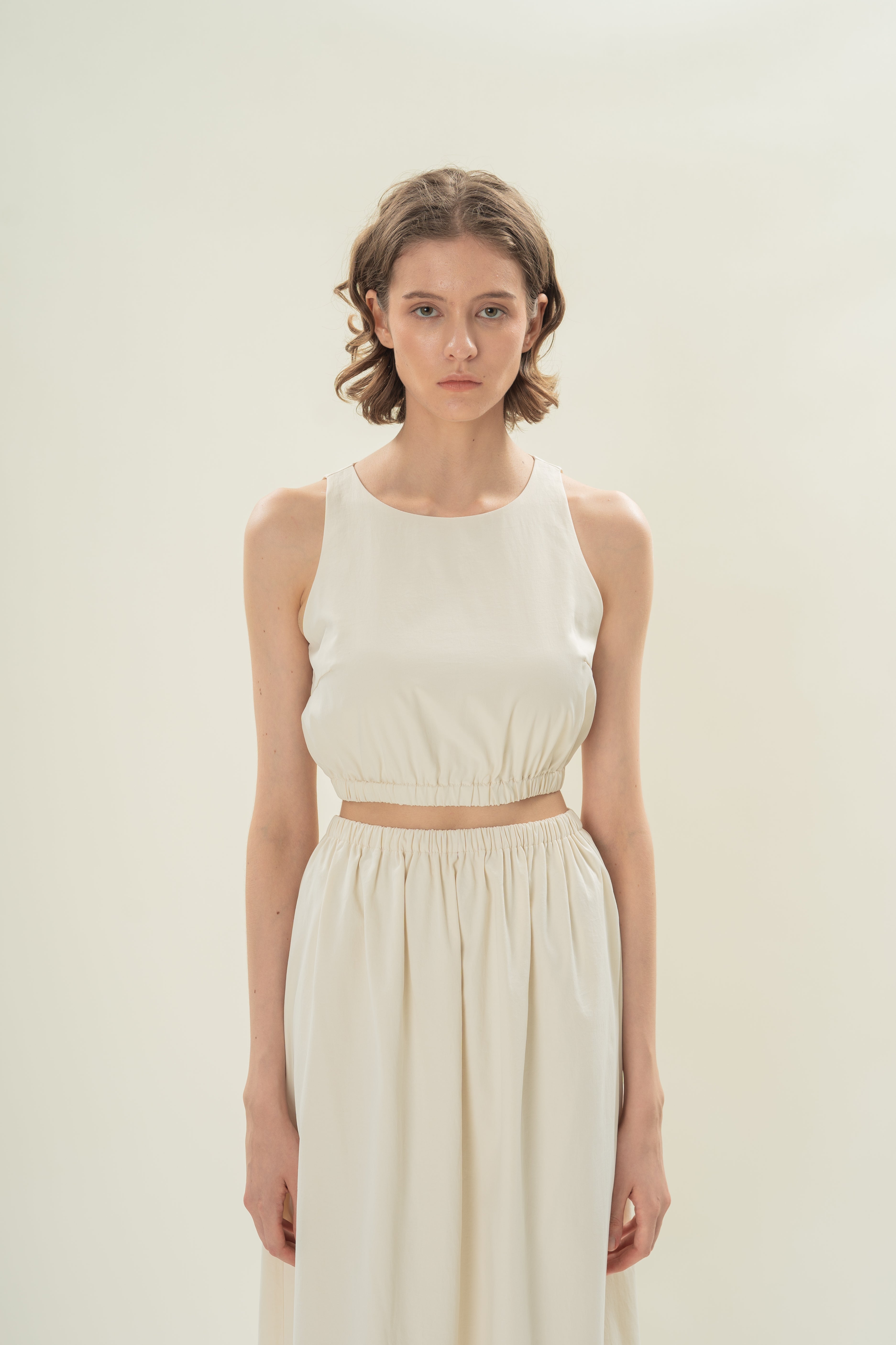 Sleeveless Cropped Gathered Waist Top in Natural