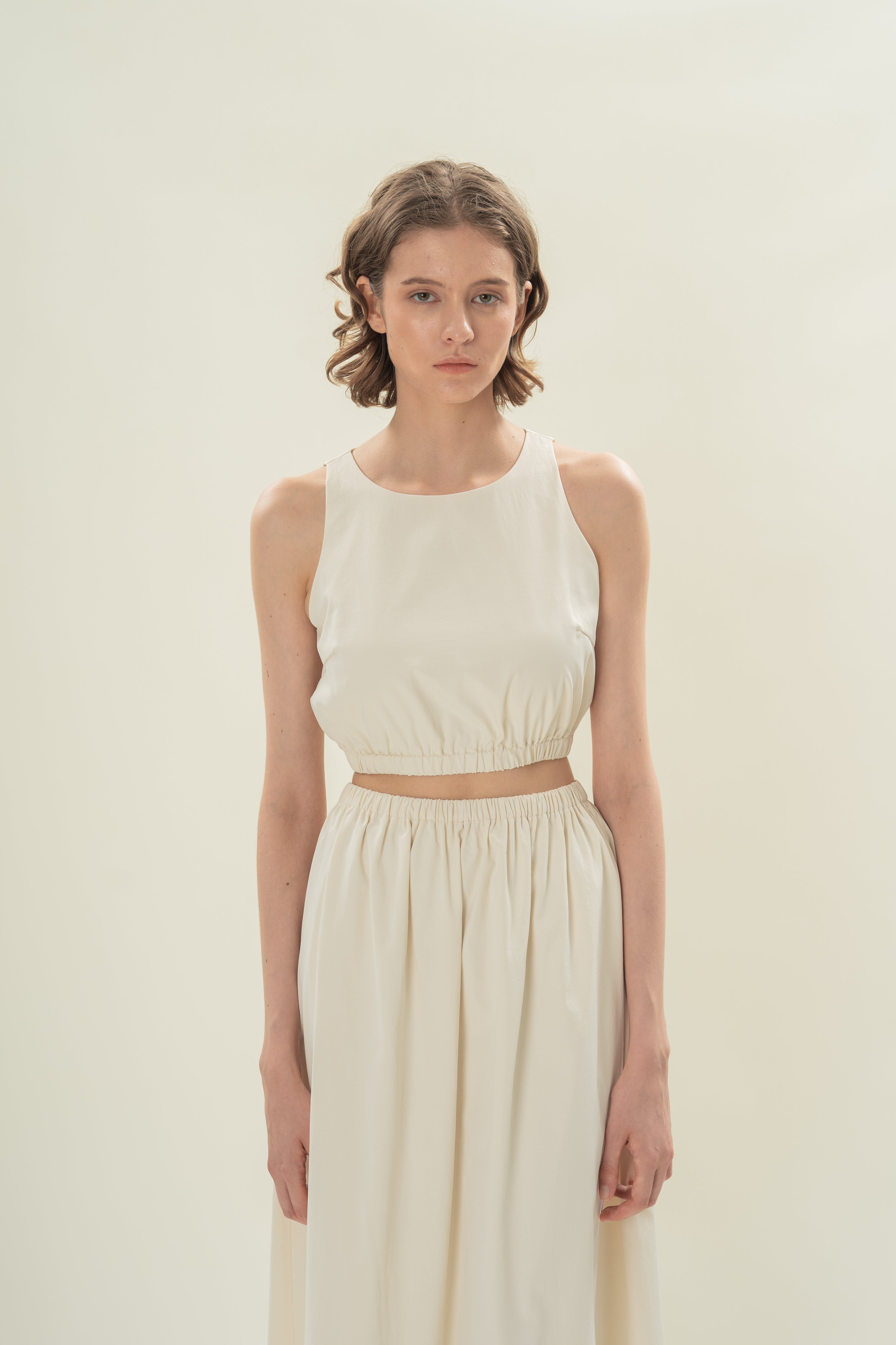 Sleeveless Cropped Gathered Waist Top in Natural