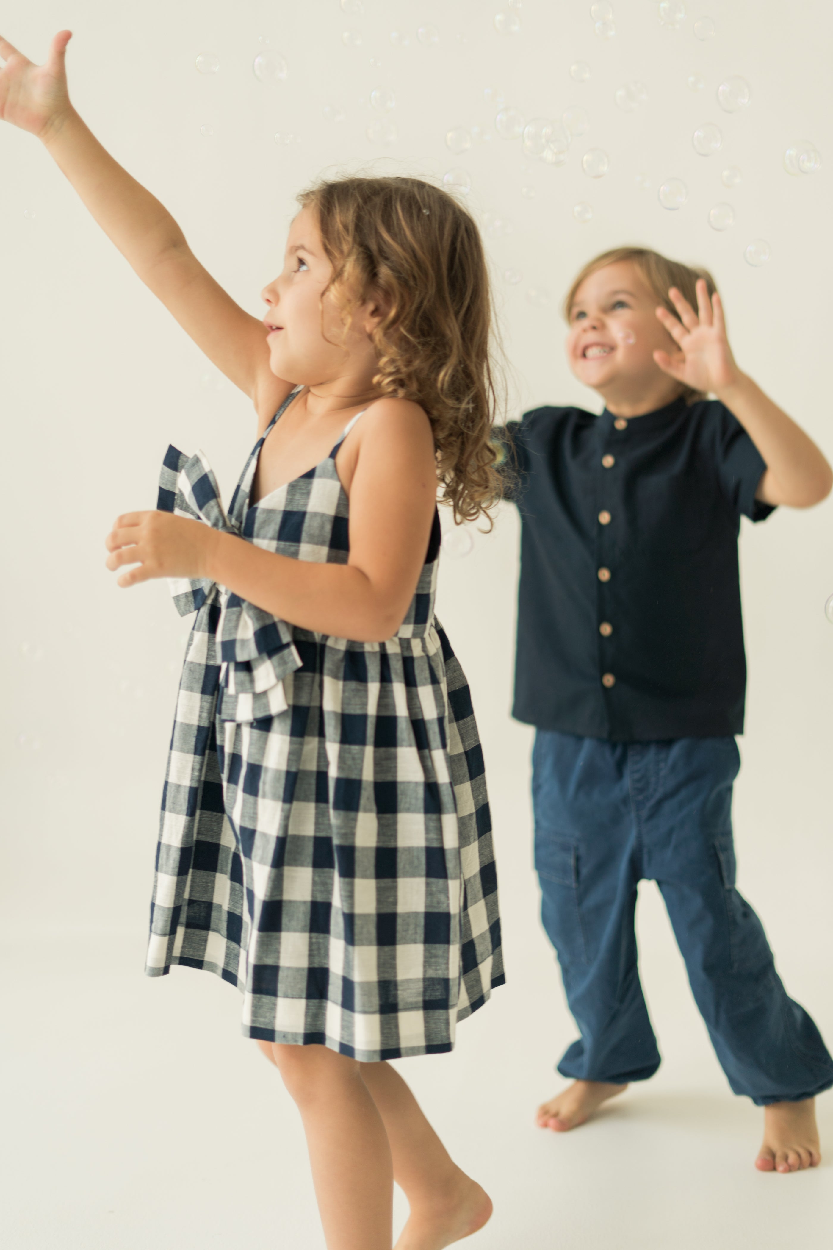 Mini Sleeveless Dress With Detachable Bow in Navy Gingham