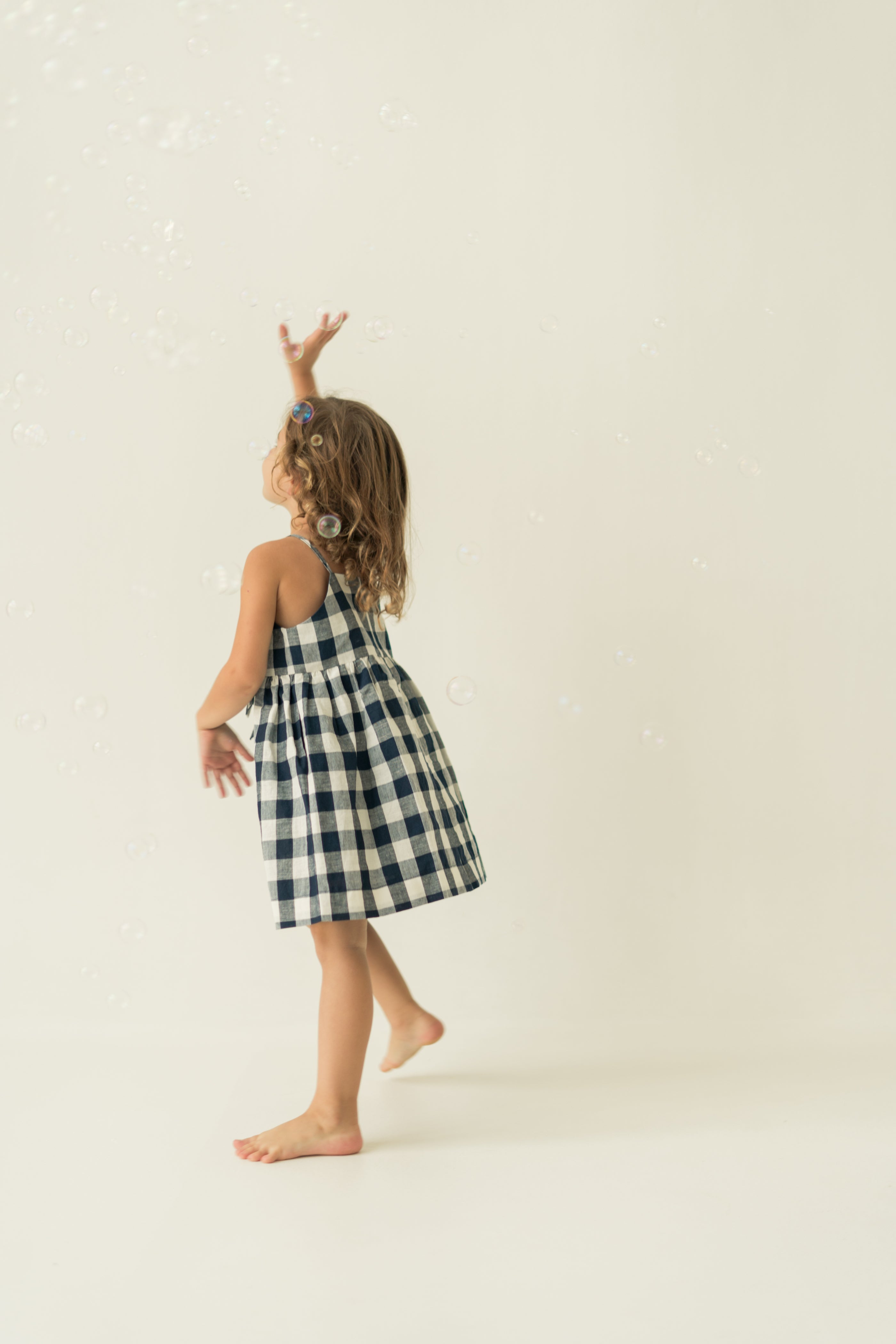 Mini Sleeveless Dress With Detachable Bow in Navy Gingham