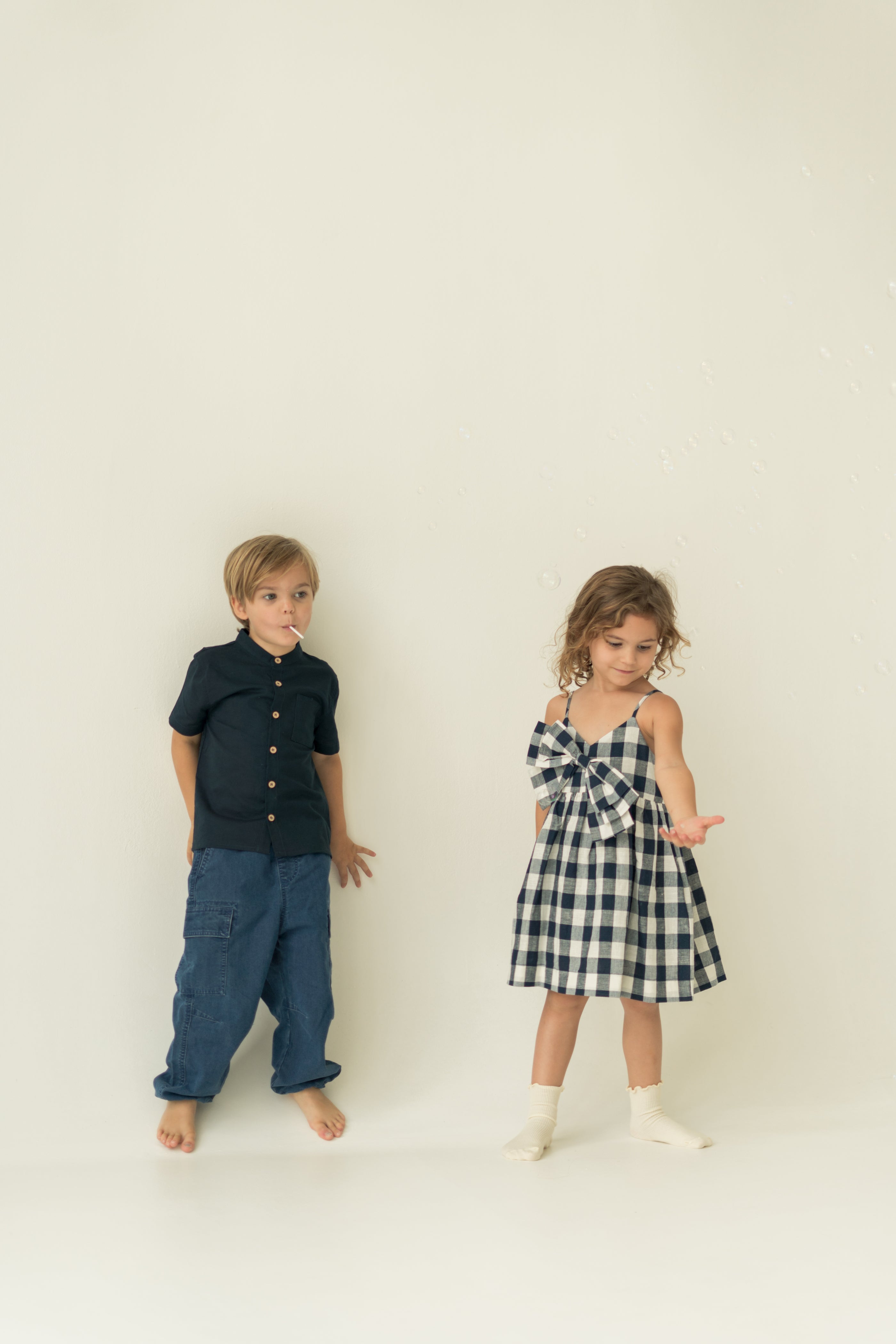 Mini Sleeveless Dress With Detachable Bow in Navy Gingham