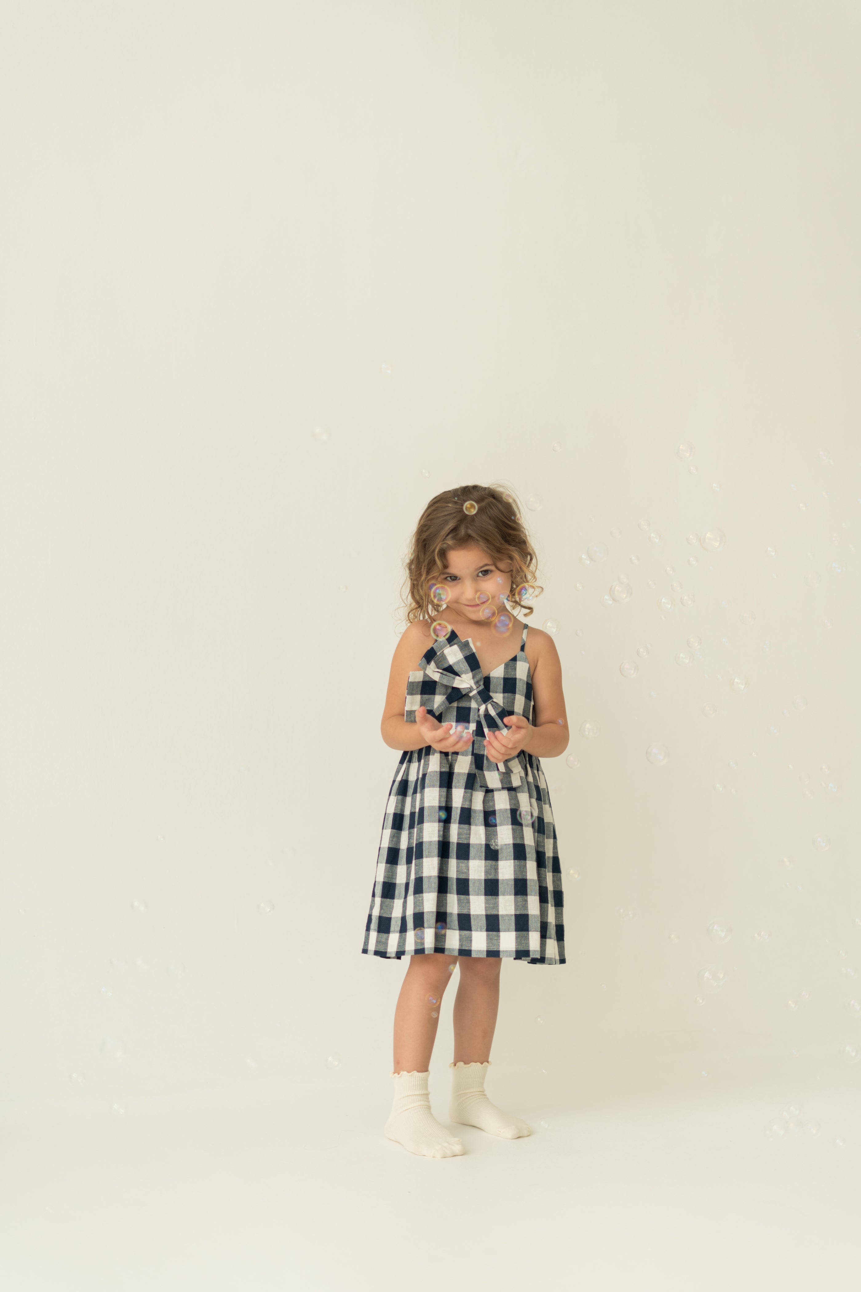 Mini Sleeveless Dress With Detachable Bow in Navy Gingham