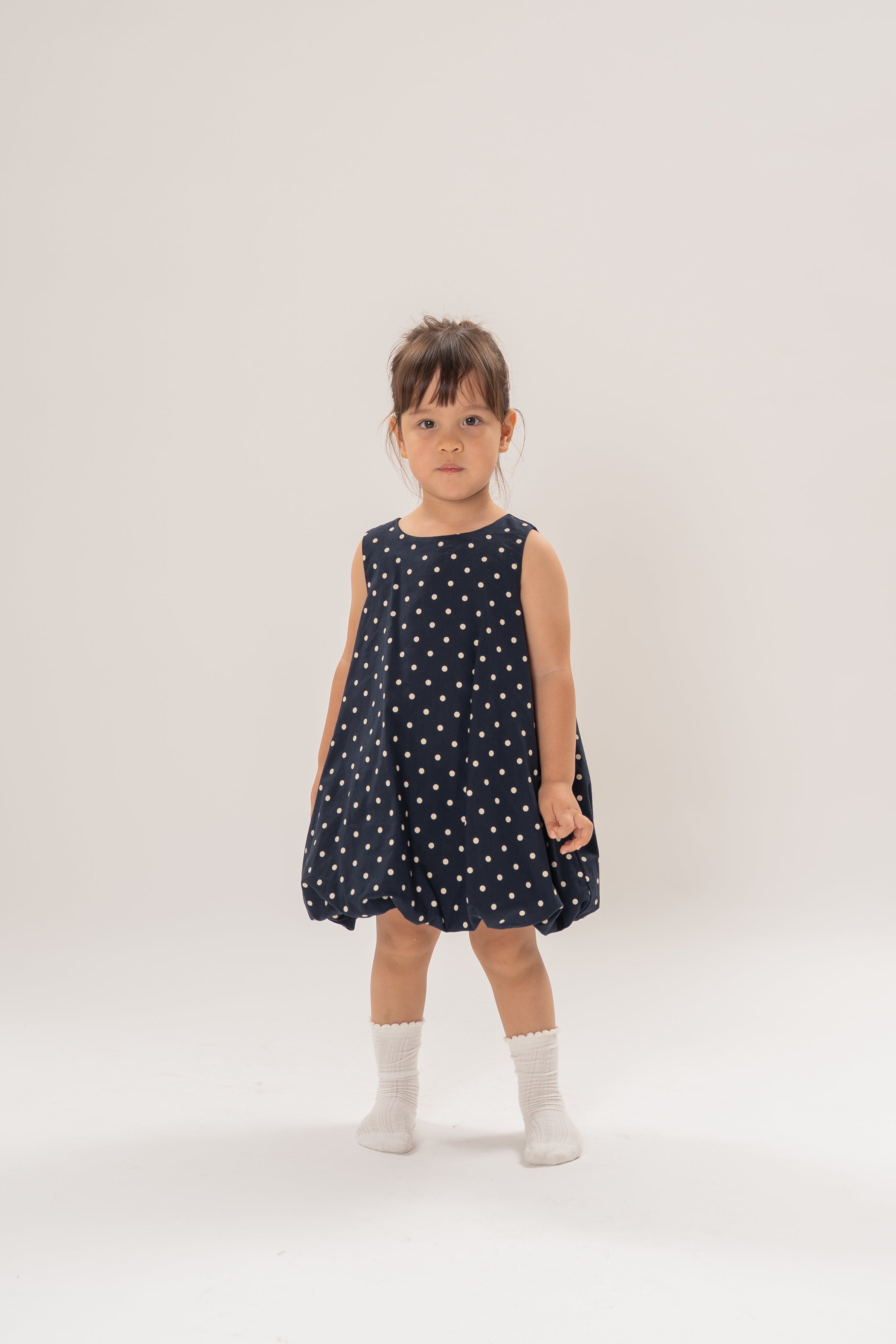 Mini Bubble Hem A-Line Dress in Polka Dot Navy