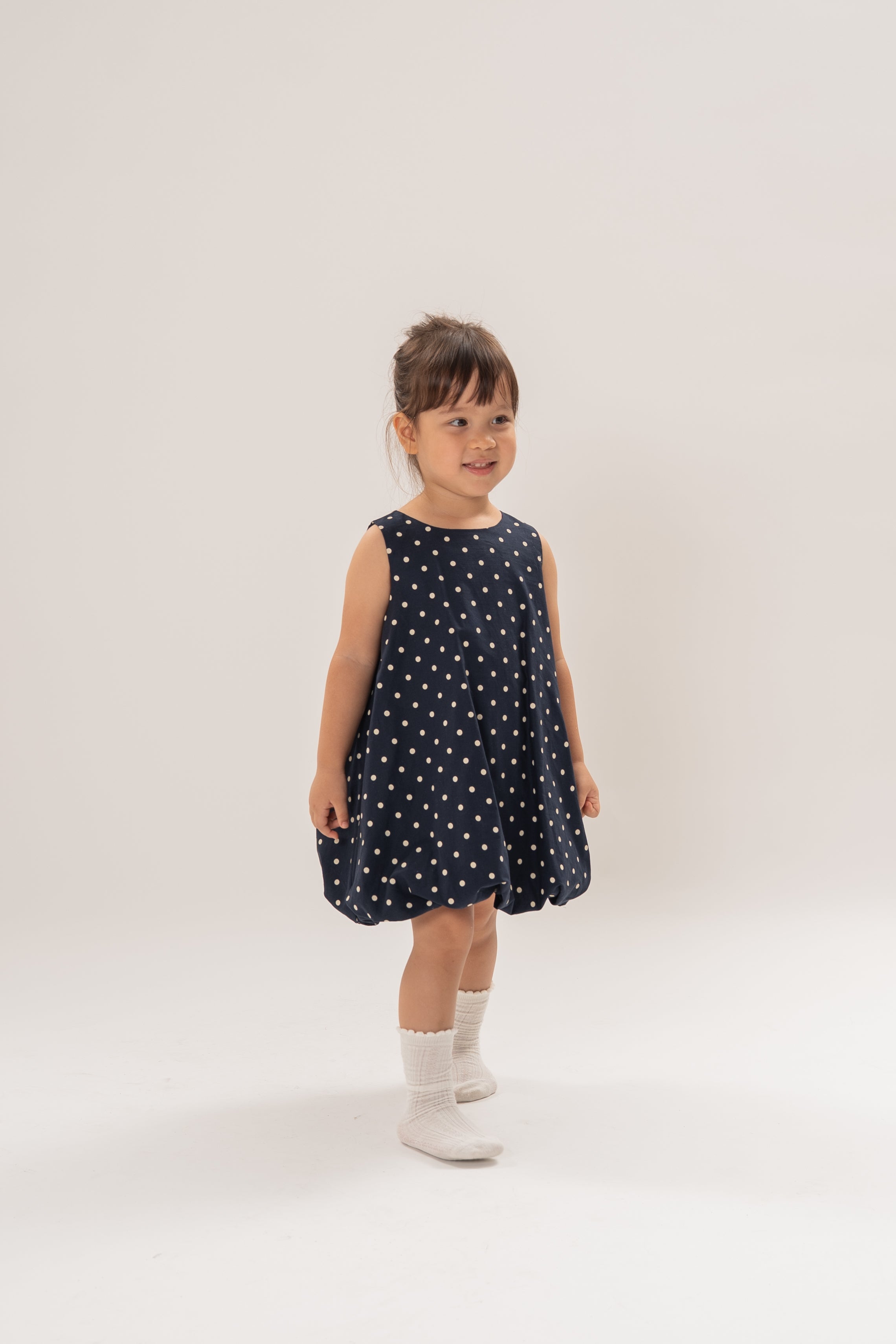 Mini Bubble Hem A-Line Dress in Polka Dot Navy